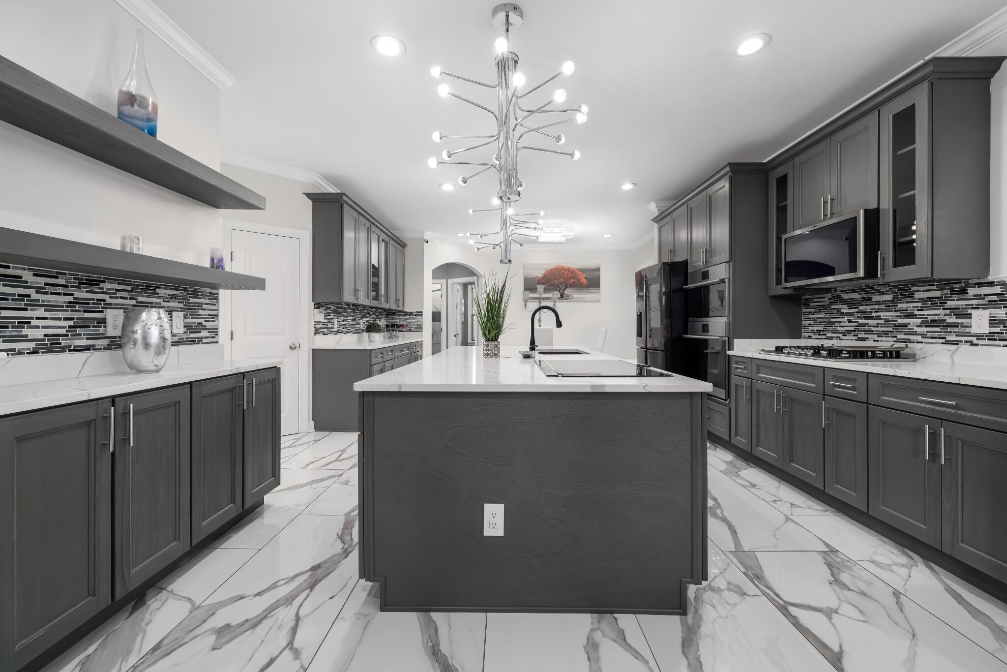 Stock image of modern gray kitchen with large island, marble floors, and contemporary lighting northern california -optimized
